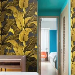 Carta da parati con foglie di banano dorate