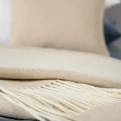 Coperta piccola beige con frange Defilé
