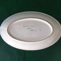 Piatto ovale con piume di pavone giallo