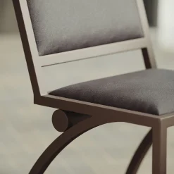 Sedia Cylindre in ferro con finitura bronzo e pelle