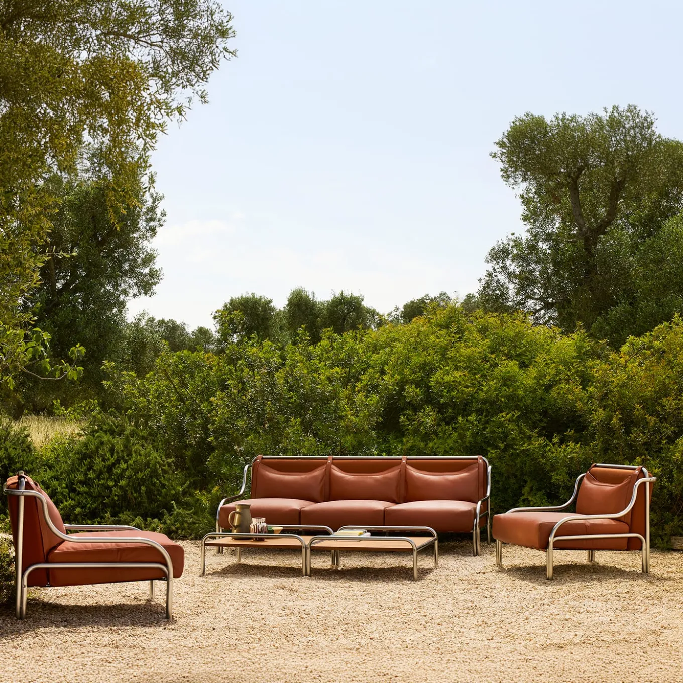 Tavolino Stringa in mogano e acciaio inox di Gae Aulenti