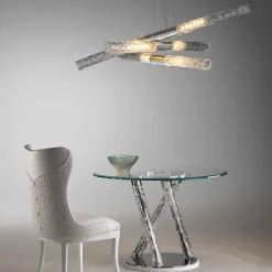 Tavolo Con Piano Rotondo In Vetro E Gambe Incorciate